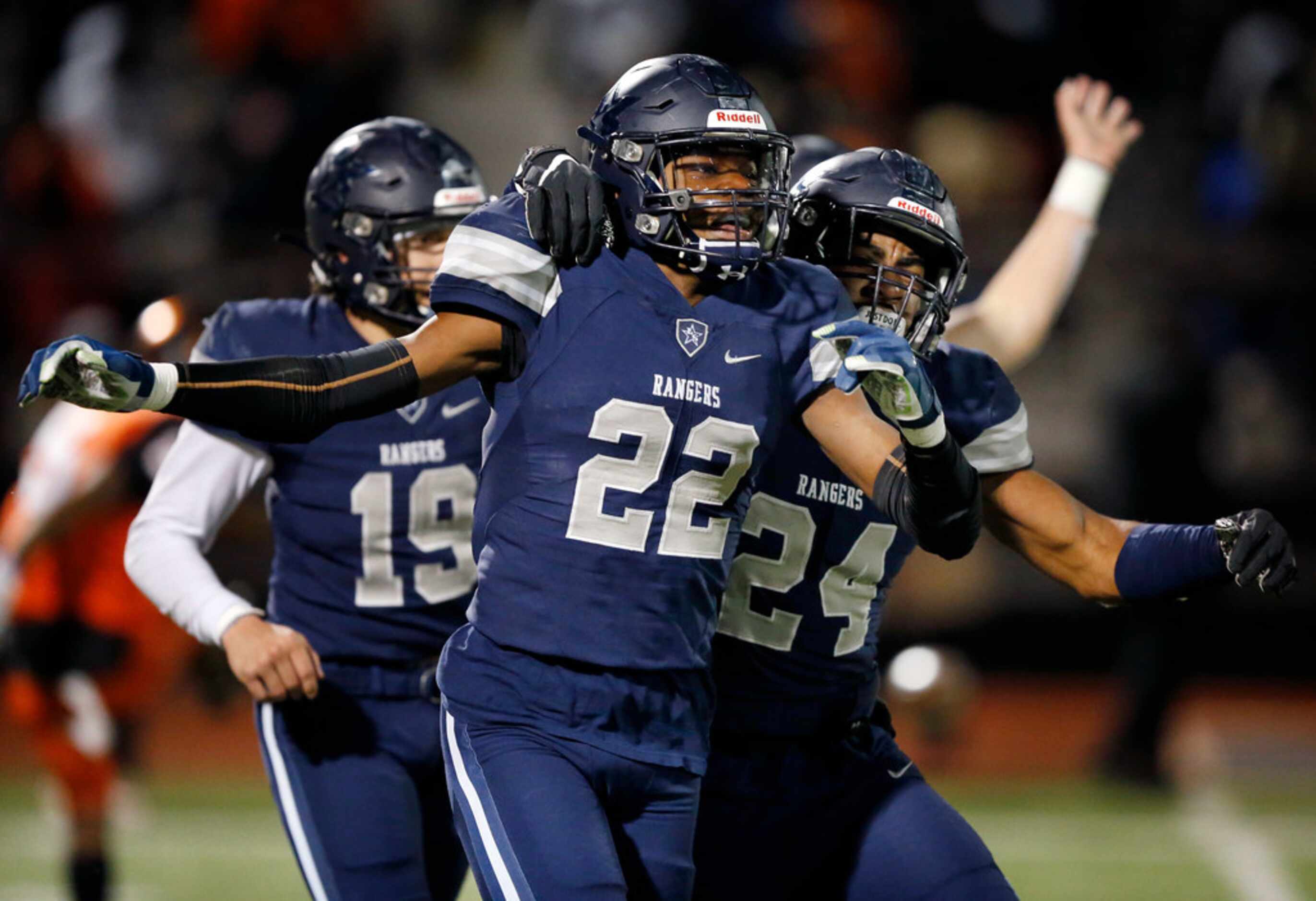 Frisco Lone Star defensive back Montrice Wrren (22) is congratulated by teammate Jaylan Ford...