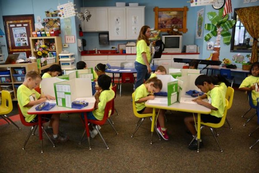 
Kindergarten teacher Shirley Penson gives her students a spelling test at Leadership Prep...