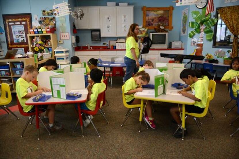 
Kindergarten teacher Shirley Penson gives her students a spelling test at Leadership Prep...