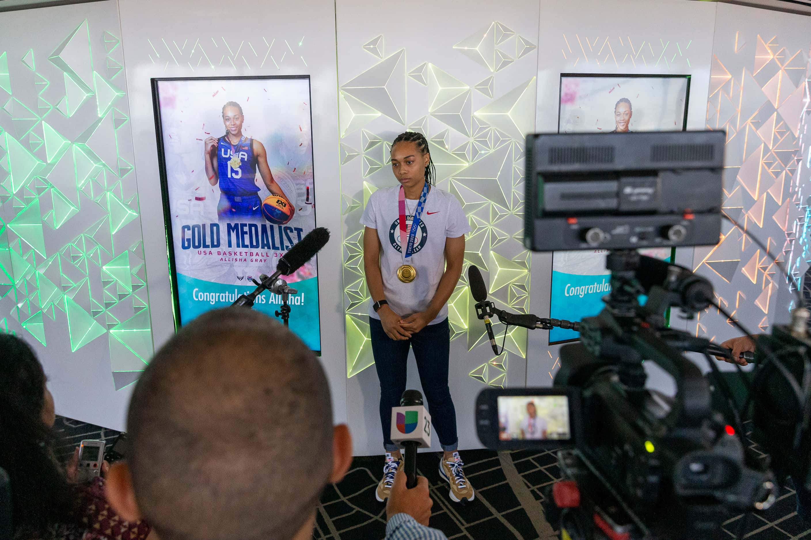 Allisha Gray, Olympic gold medalist and Dallas Wings guard, listens to a question during a...