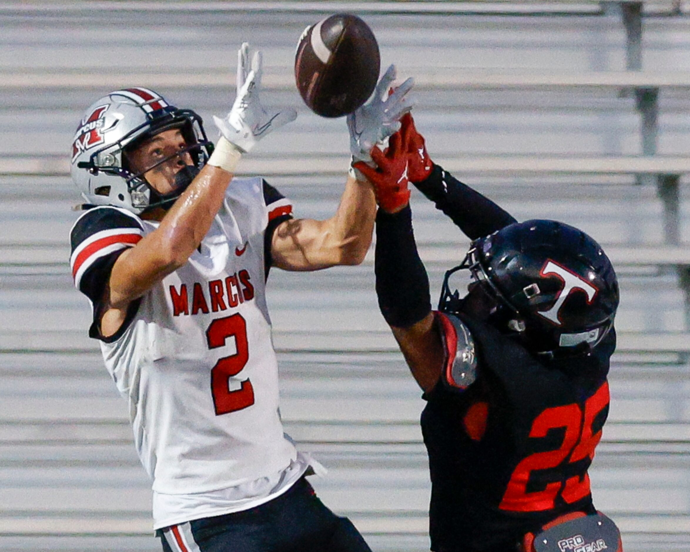 Flower Mound Marcus Karic Grennan (2) catches a pass over Euless Trinity linebacker DJ...