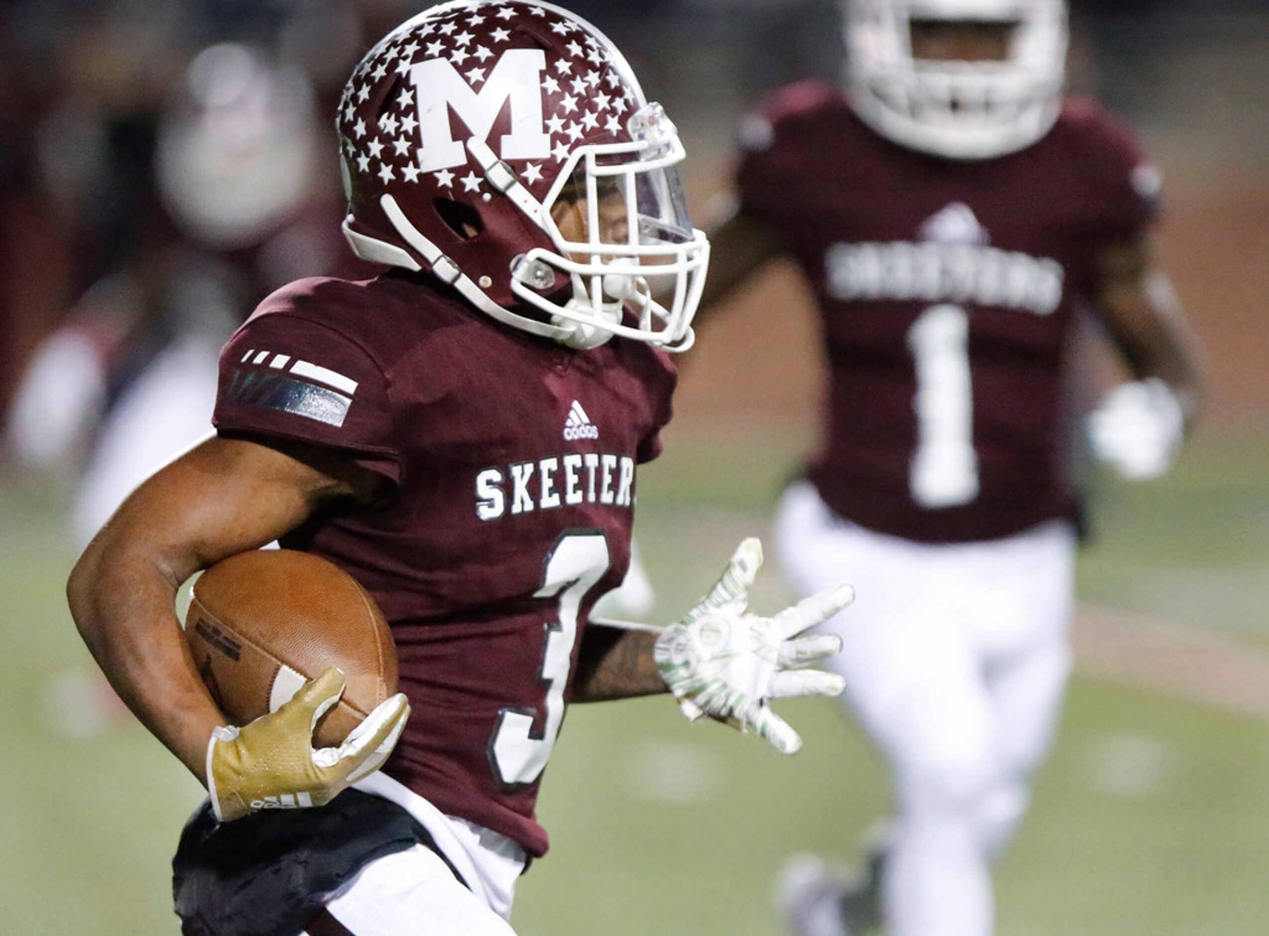 Mesquite High School kick returner Gary Green (3) takes the opening kick off during the...