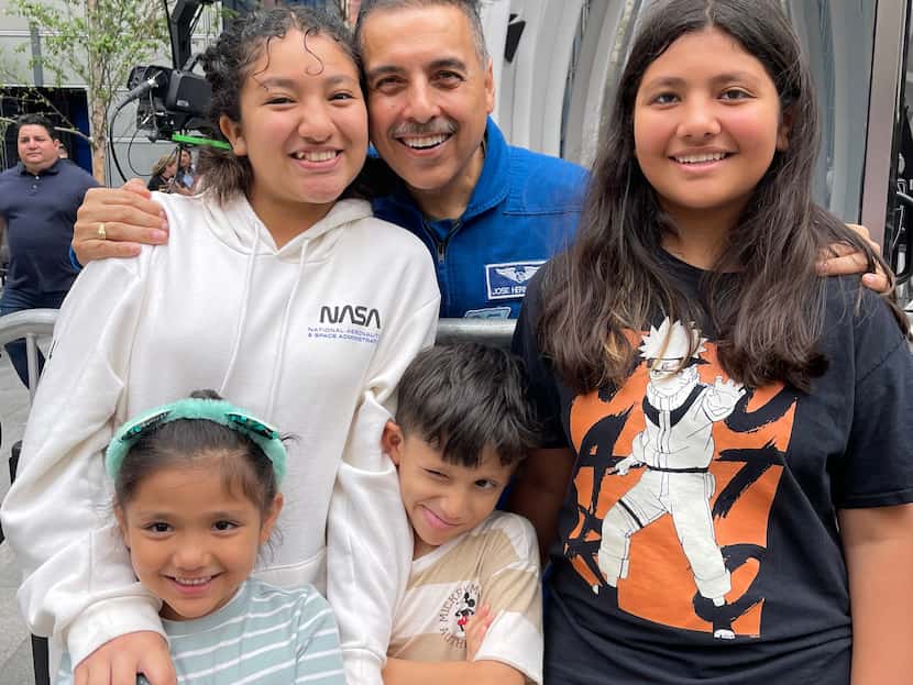 Galilea Baca, 13, of Garland (left) is photographed with retired NASA astronaut Jose...