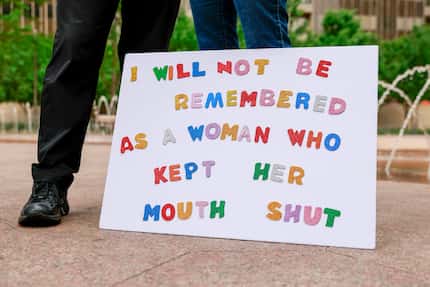 A sign rests on the ground during a rally in support of abortion rights at the Civic Garden...
