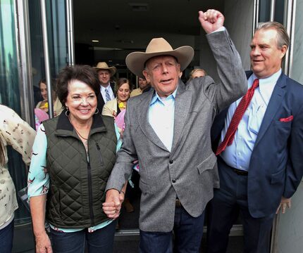 Cliven Bundy walks out of federal court with his wife, Carol, in Las Vegas in January....