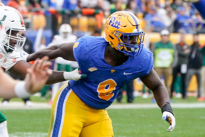 Pittsburgh defensive lineman Calijah Kancey (8) plays against Miami during an NCAA college...