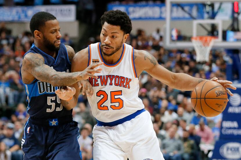 Dallas Mavericks' Pierre Jackson (55) defends as New York Knicks guard Derrick Rose (25)...