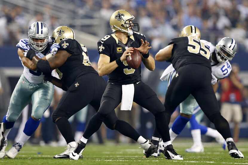New Orleans Saints quarterback Drew Brees (9) drops into the pocket and looks down field for...