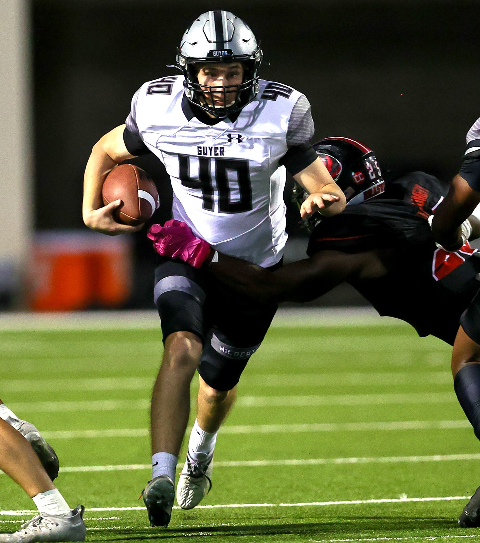 Denton Guyer punter Jaxon Pirtile (40) finds a hole to run after a fake punt attempt against...