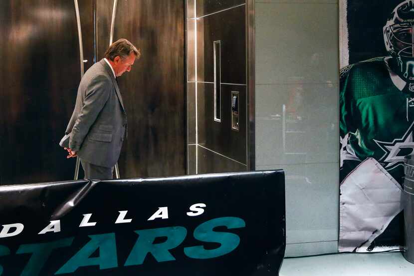 Dallas Stars interim head coach Rick Bowness takes a moment to himself prior to heading to...