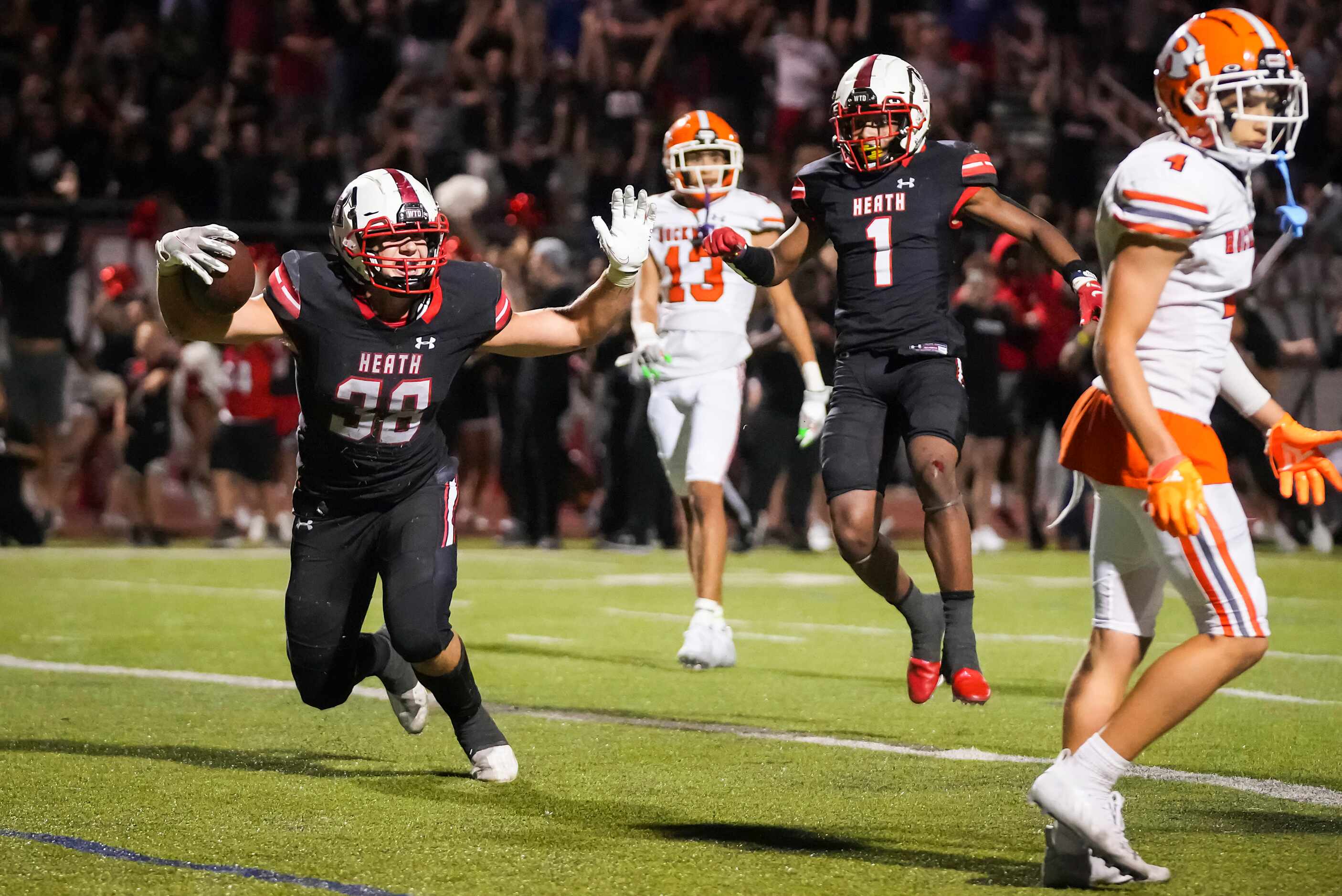 Rockwall-Heath tight end  Lance Mason (38) celebrates after scoring on a 21-yard touchdown...