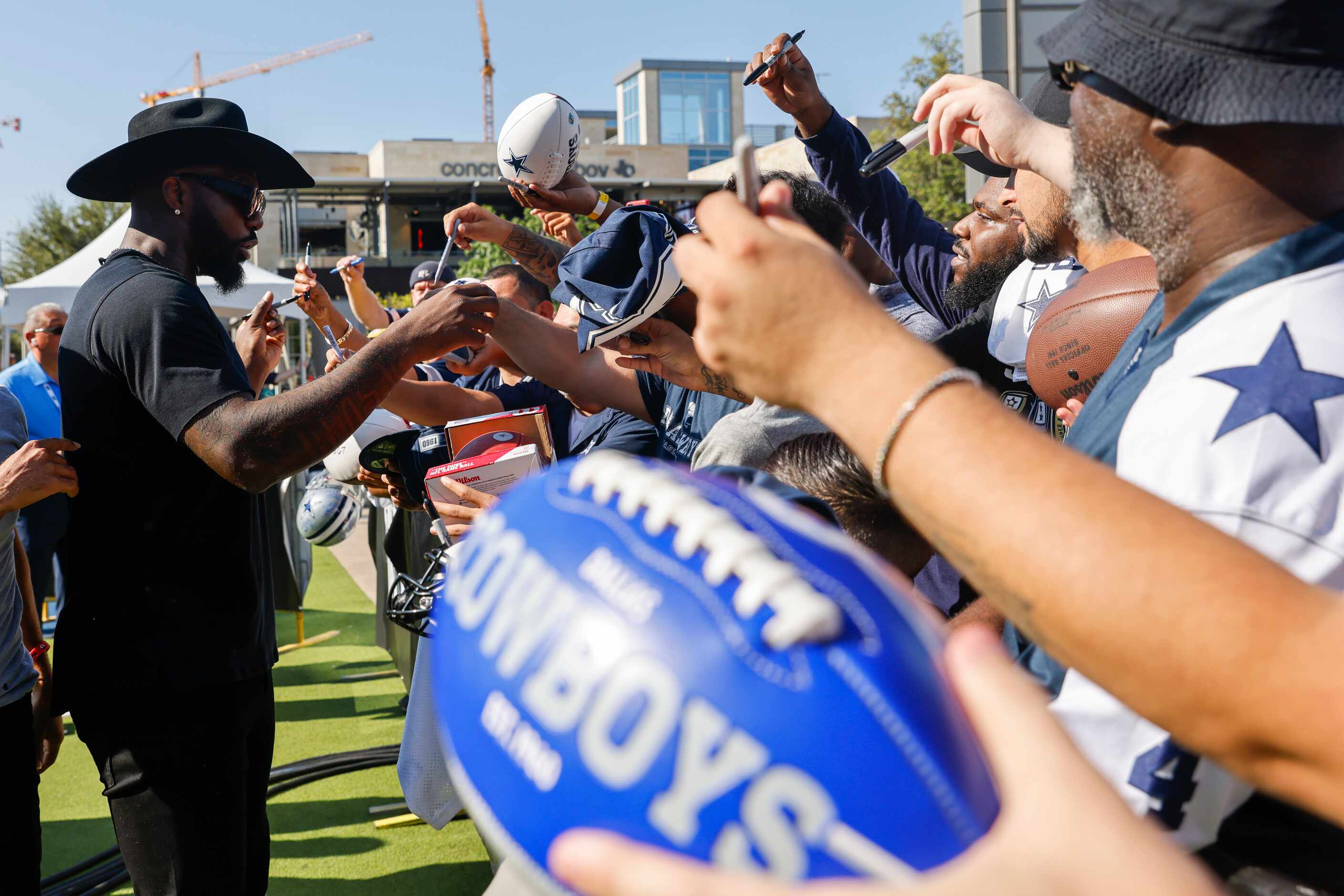 Former Dallas Cowboys player Dez Bryant gives autographs to the crowd during the recording...