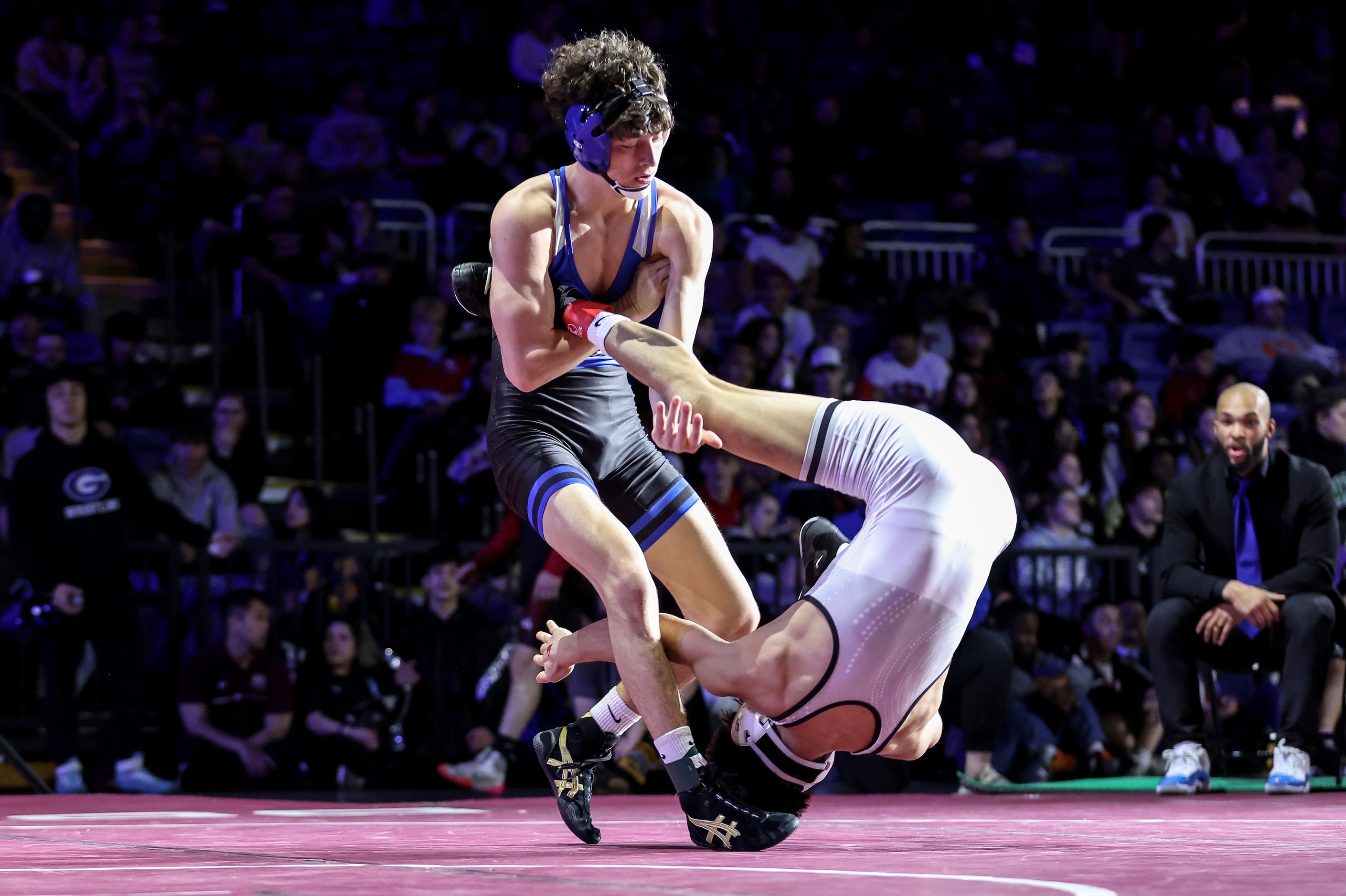 Eli Biermann of Midlothian (blue) competes against Nathaniel Ruiz of Canyon Randall  Boys 5A...