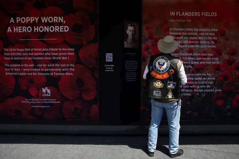 A Vietnam veteran visits the USAA Poppy Wall of Honor on the National Mall in Washington,...