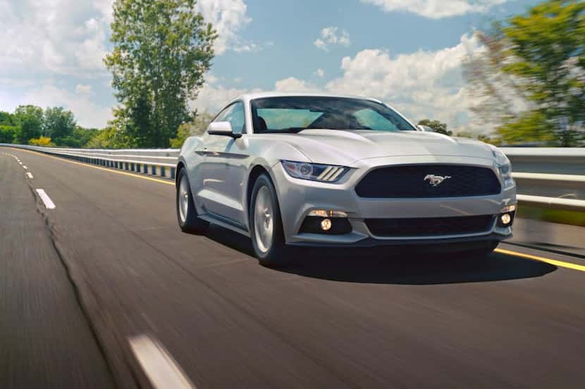 
The 2015 Ford Mustang sports a long flat hood and lengthy front fenders that give the car...