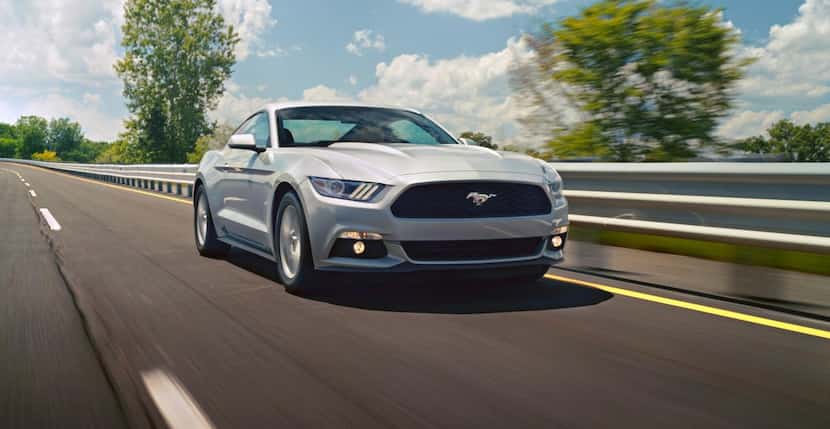 
The 2015 Ford Mustang sports a long flat hood and lengthy front fenders that give the car...