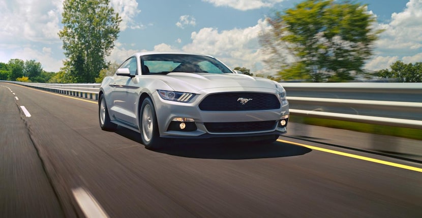 
The 2015 Ford Mustang sports a long flat hood and lengthy front fenders that give the car...