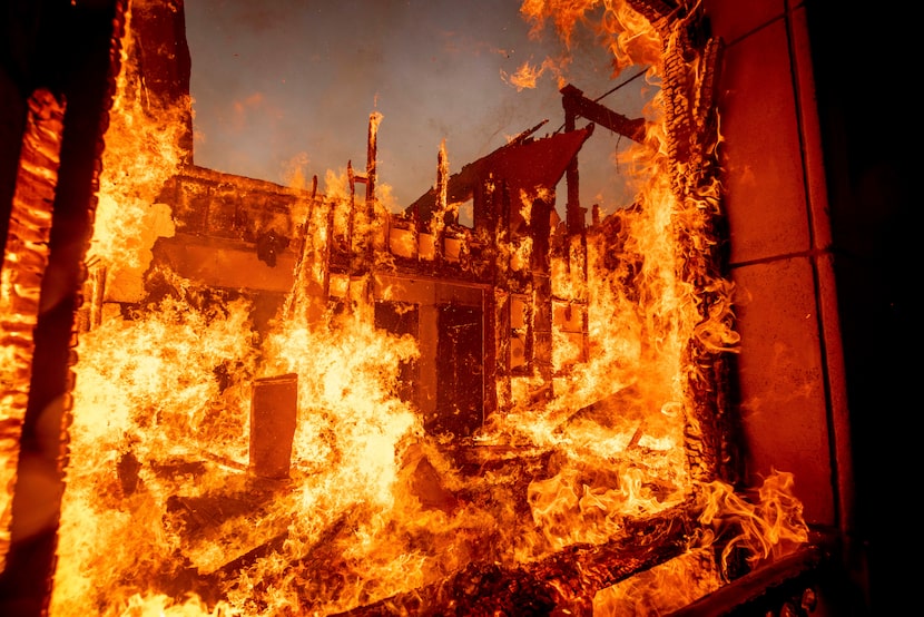 The Palisades Fire burns a residence in the Pacific Palisades neighborhood of Los Angeles,...