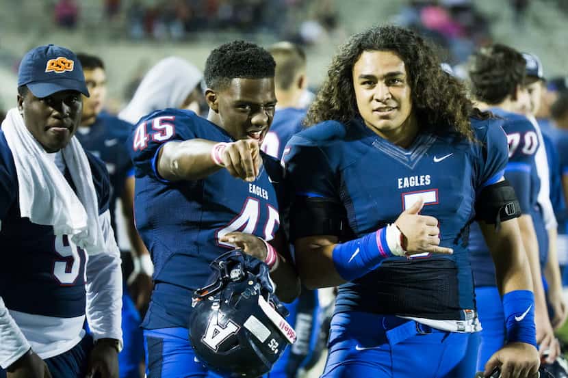 Allen running back Kirby Bennett (45) and linebacker Sione Tupou (5) ham it up on the...