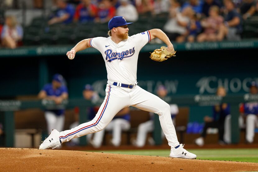 Texas Rangers starting pitcher Jon Gray (22) delivers a pitch in the first inning against...