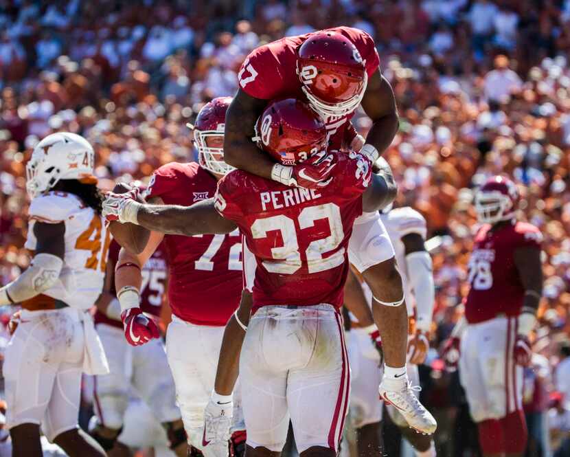 Oklahoma Sooners running back Samaje Perine (32) celebrates scoring a touchdown with...