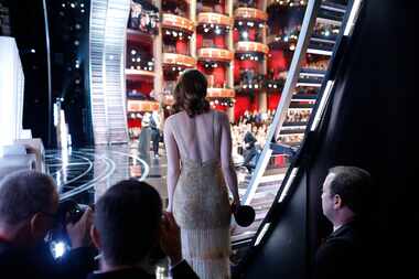 Emma Stone holds her Oscar for best actress in a leading role for her performance in "La La...