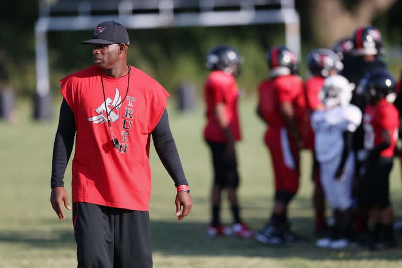 Deion Sanders gives instructions during a summer football camp at Prime Prep Academy of...