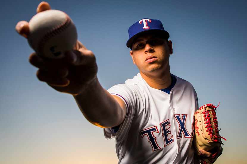 Texas Rangers pitcher Ariel Jurado  poses for a photo during Spring Training picture day at...