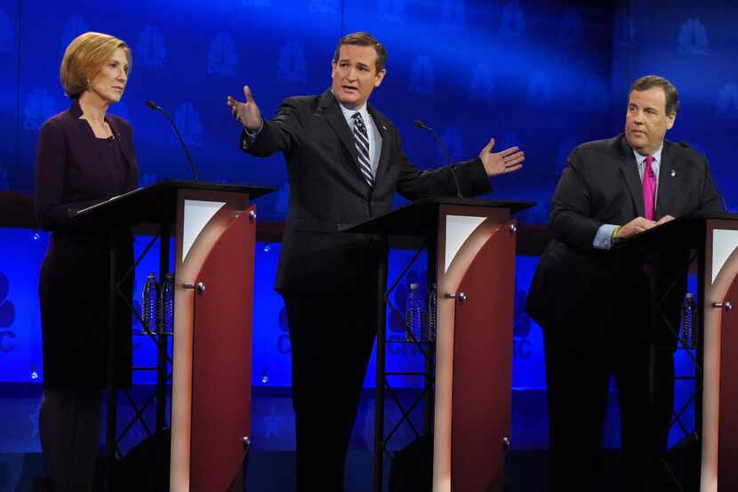 Ted Cruz talks about the mainstream media as Carly Fiorina and Chris Christie look on during...