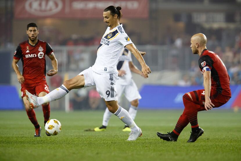 Los Angeles Galaxy forward Zlatan Ibrahimovic (9) controls the ball against Toronto FC...