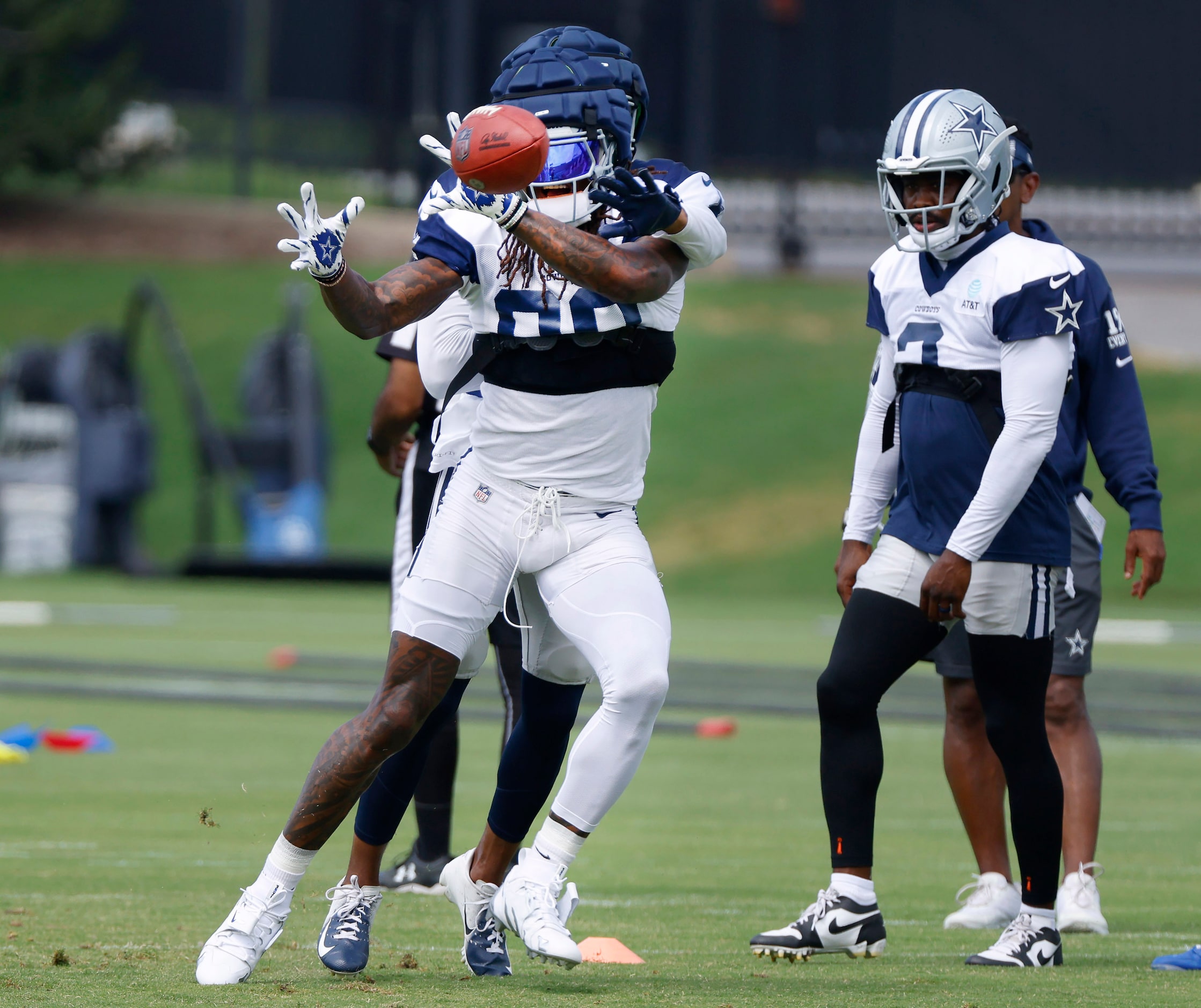 Dallas Cowboys wide receiver CeeDee Lamb (88) catches pass as he’s covered by a teammate...