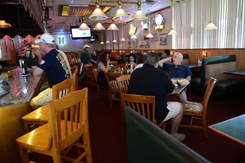Patrons dine in the former smoking section of Po' Melvin's, which voluntarily went...