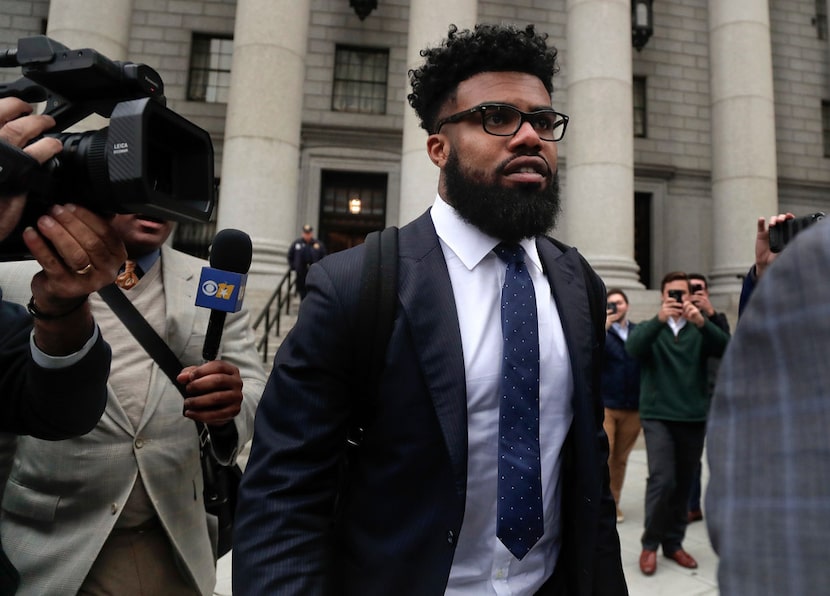 Dallas Cowboy Ezekiel Elliott walks out of federal court on Thursday in New York. 