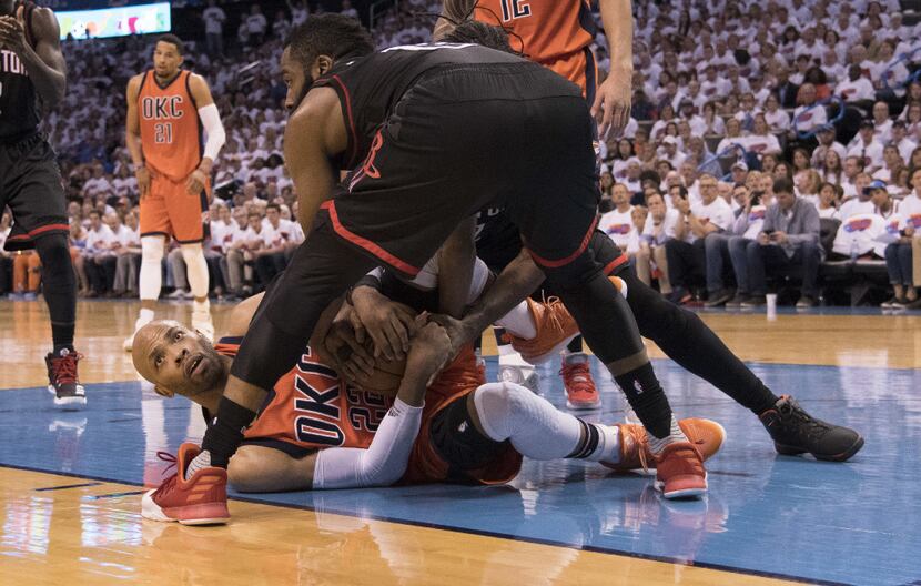 OKLAHOMA CITY, OK - APRIL 23:  Taj Gibson #22 of the Oklahoma City Thunder and James Harden...