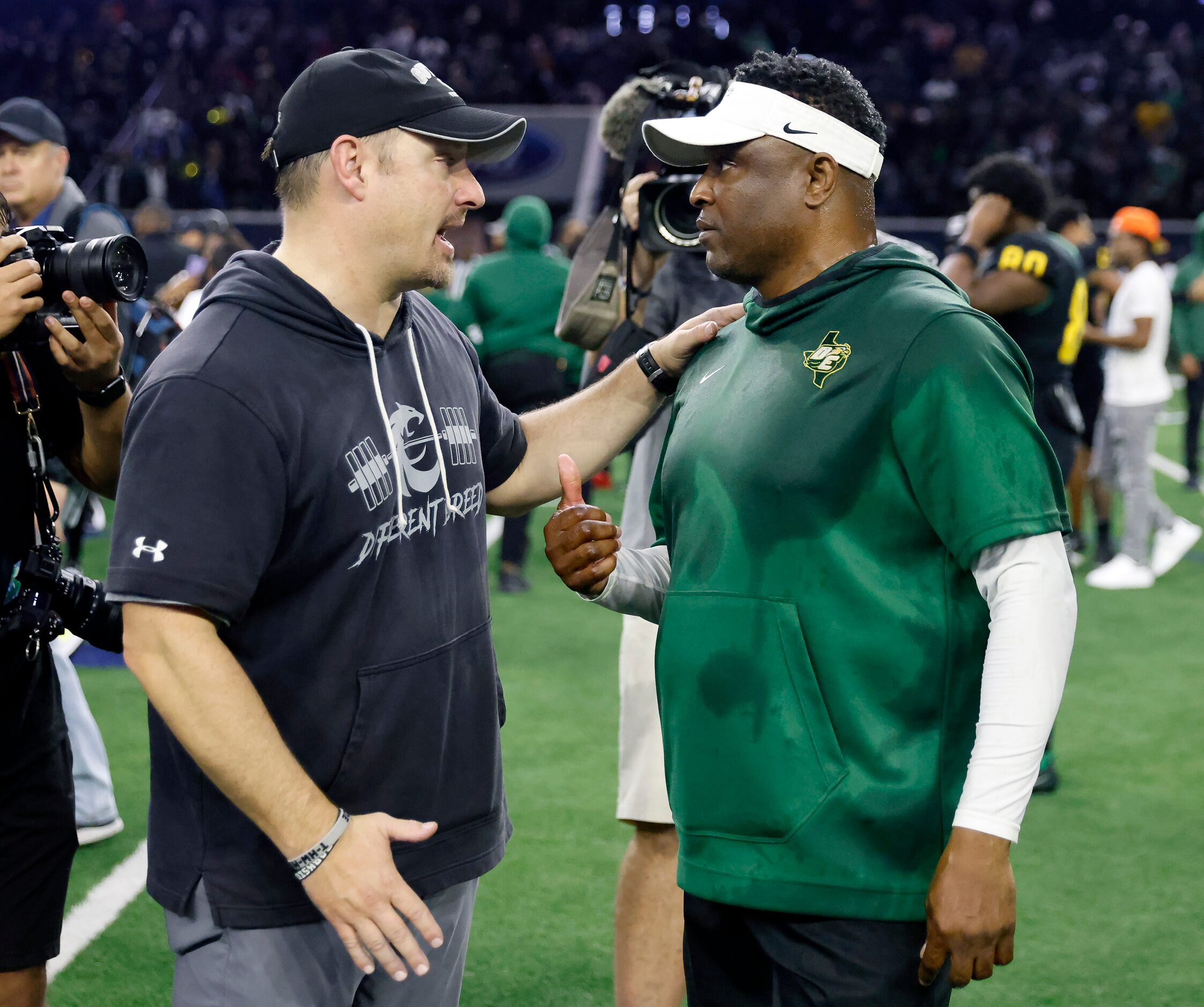 Denton Guyer head coach Reed Heim (right) congratulates DeSoto head coach Claude Mathis on...