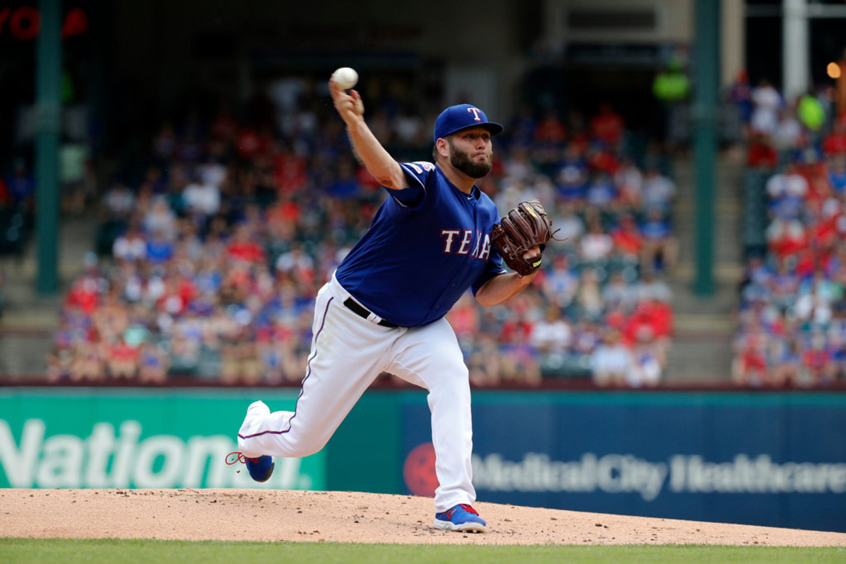 Texas Rangers starting pitcher Lance Lynn works against the Kansas City Royals int the first...