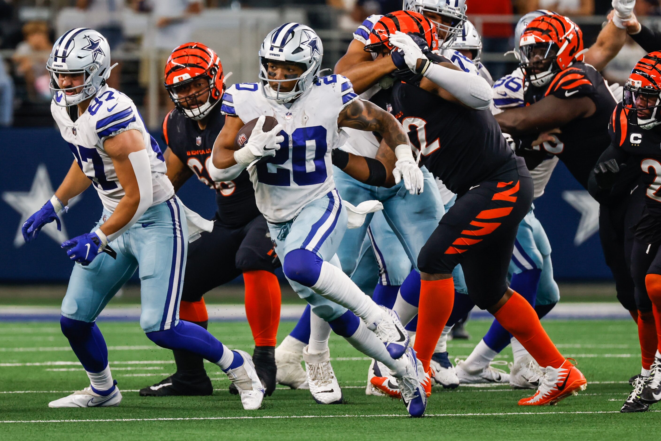 Dallas Cowboys running back Tony Pollard (20) runs with the football against the Cincinnati...