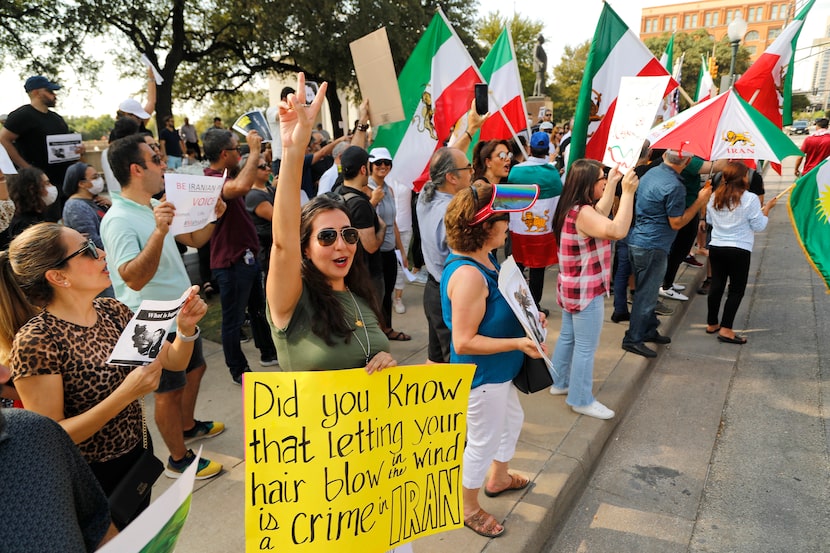 Armed with a poster, Golnaz Anbarghalami joined hundreds of others in Sunday's demonstration.