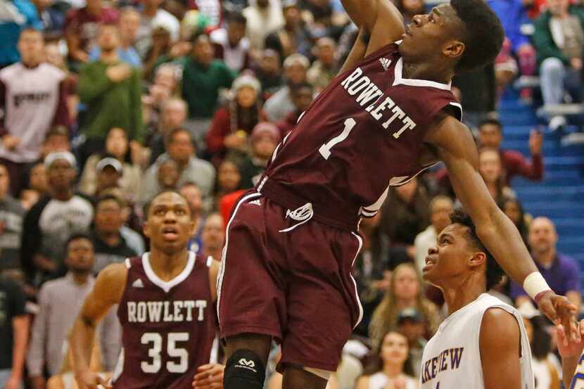 Rowlett's Michael Kolawole (1) goes in for a layup in the fourth quarter of Rowlett's win...