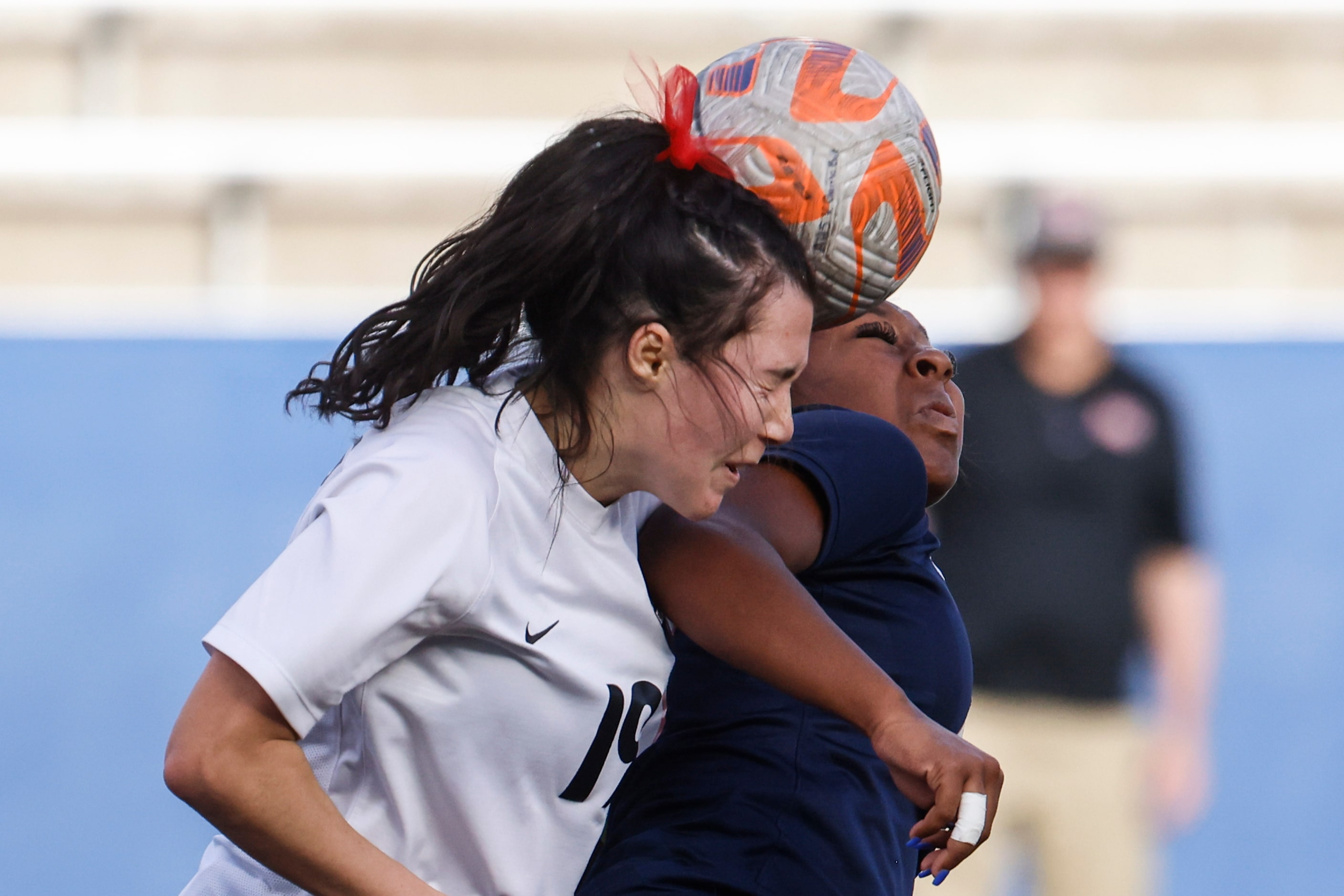 Marcus’ Carys Torgesen (left) and Melania Fullerton clashes while heading the ball during...