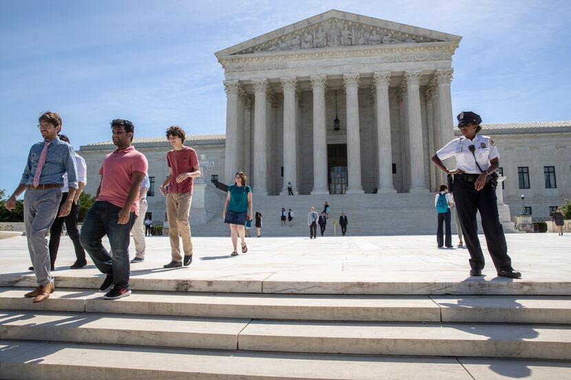 Visitors depart the Supreme Court early Monday, June 25, 2018. The justices are expected to...
