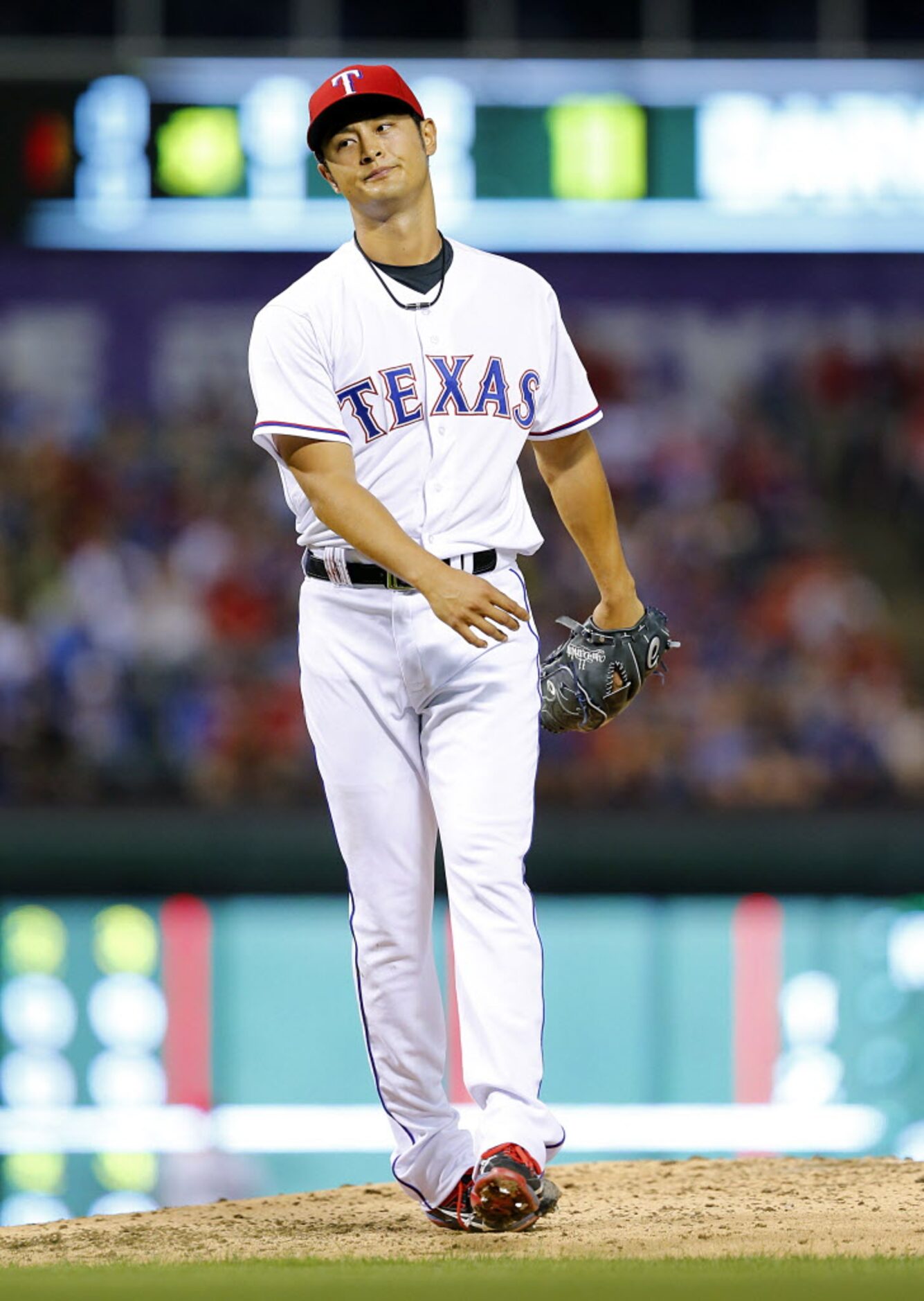 Texas Rangers starting pitcher Yu Darvish (11) reacts to a called ball which he thought was...