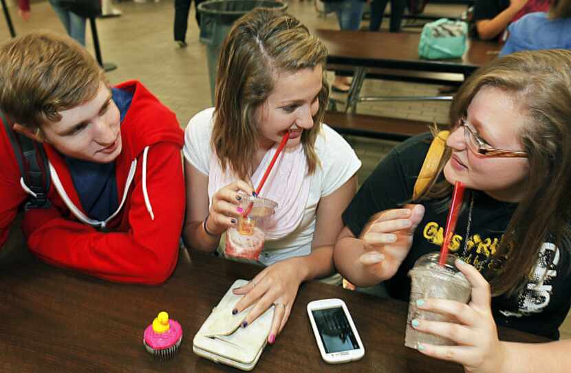 Colony High students (from left) Connor Harvey, Maddie Lustig and Jasmine Contreras gathered...