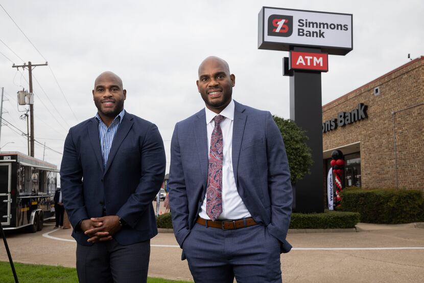 Twin brothers Terrence (left) and Tim Maiden pose for a photo outside of the Simmons Bank on...
