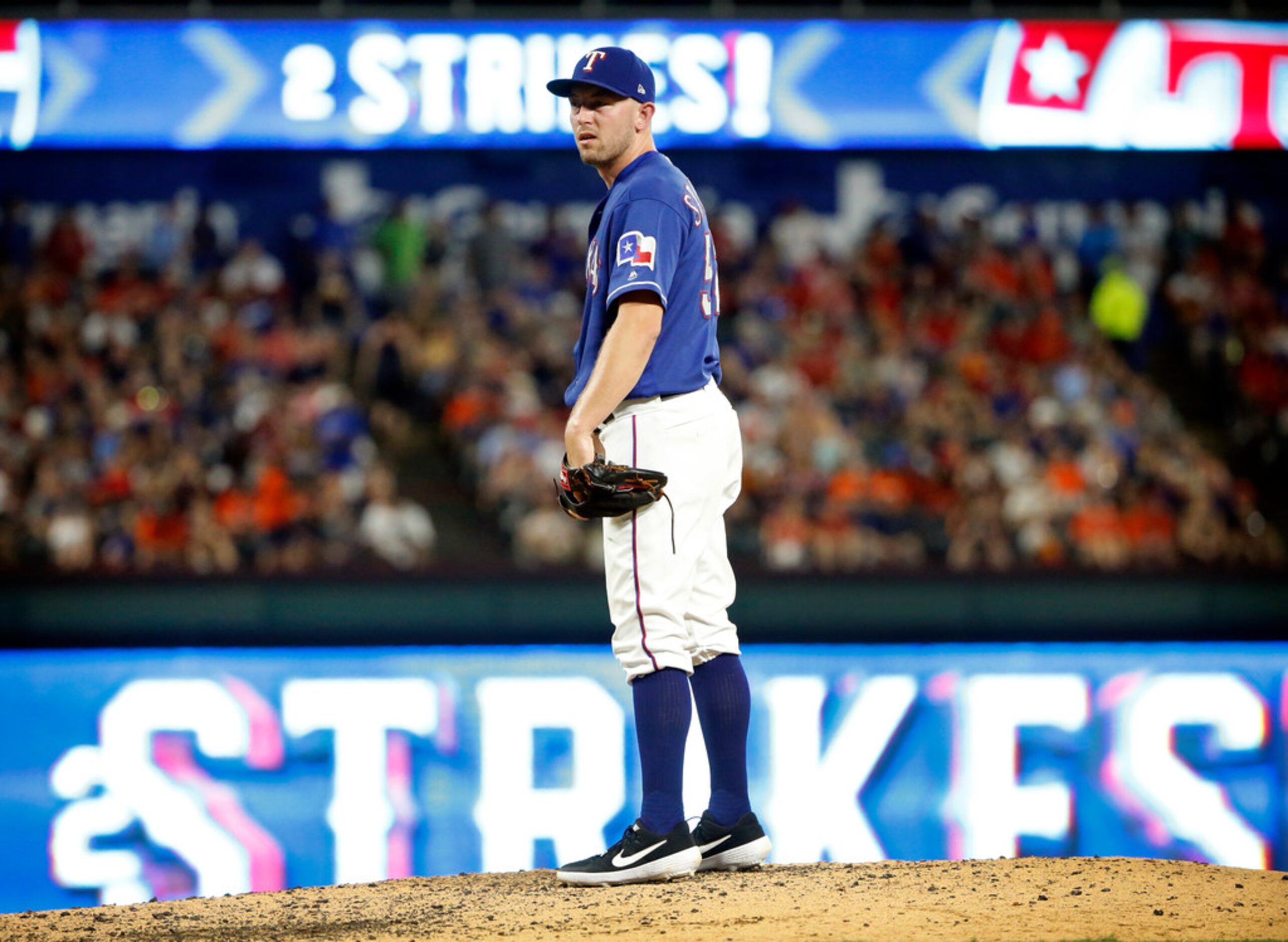 Texas Rangers starting pitcher Adrian Sampson (52) came in for Phillips Valdez to get out of...