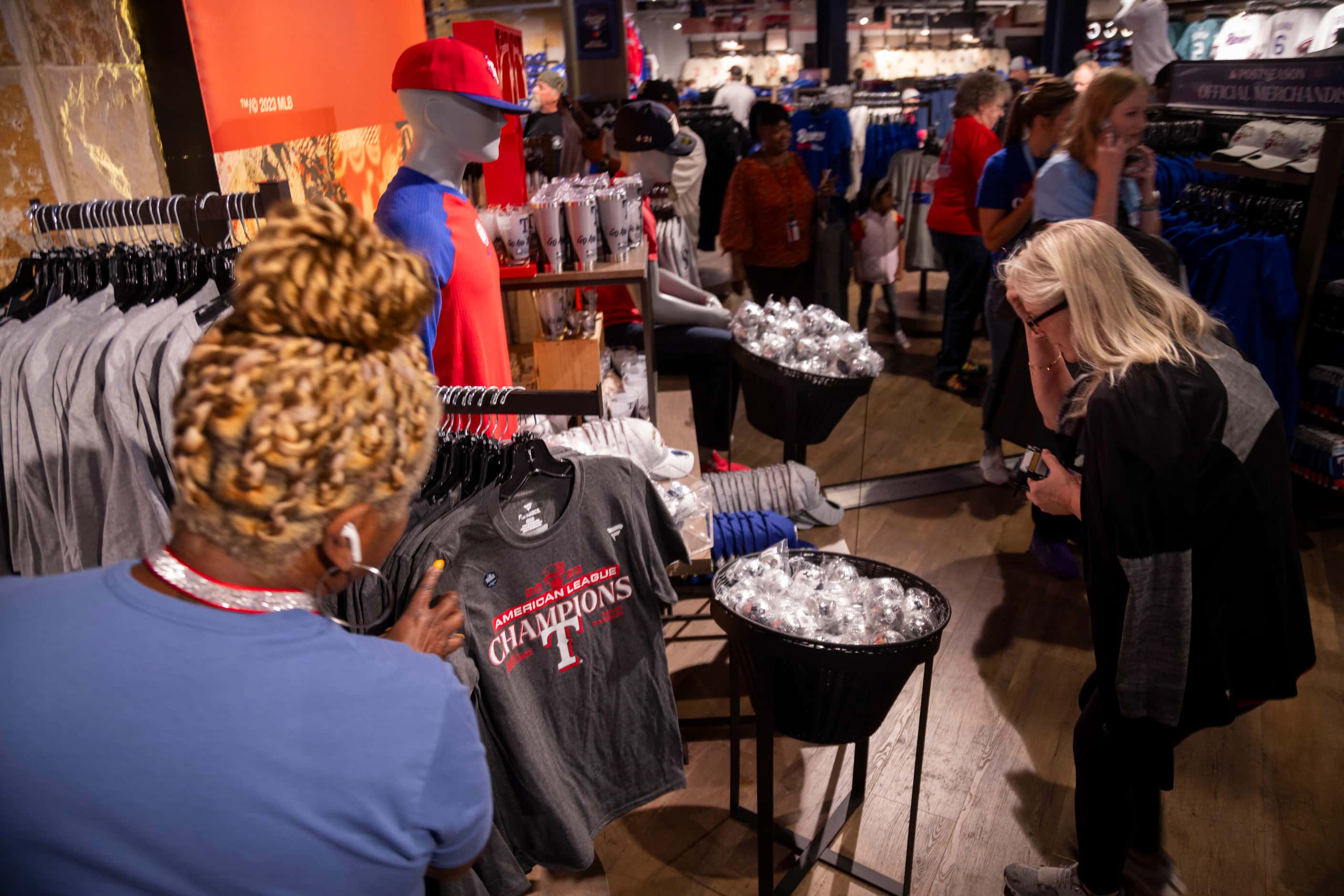Fans shop at the Grand Slam Team Store in Arlington on Tuesday, Oct. 24, 2023. Texas Rangers...