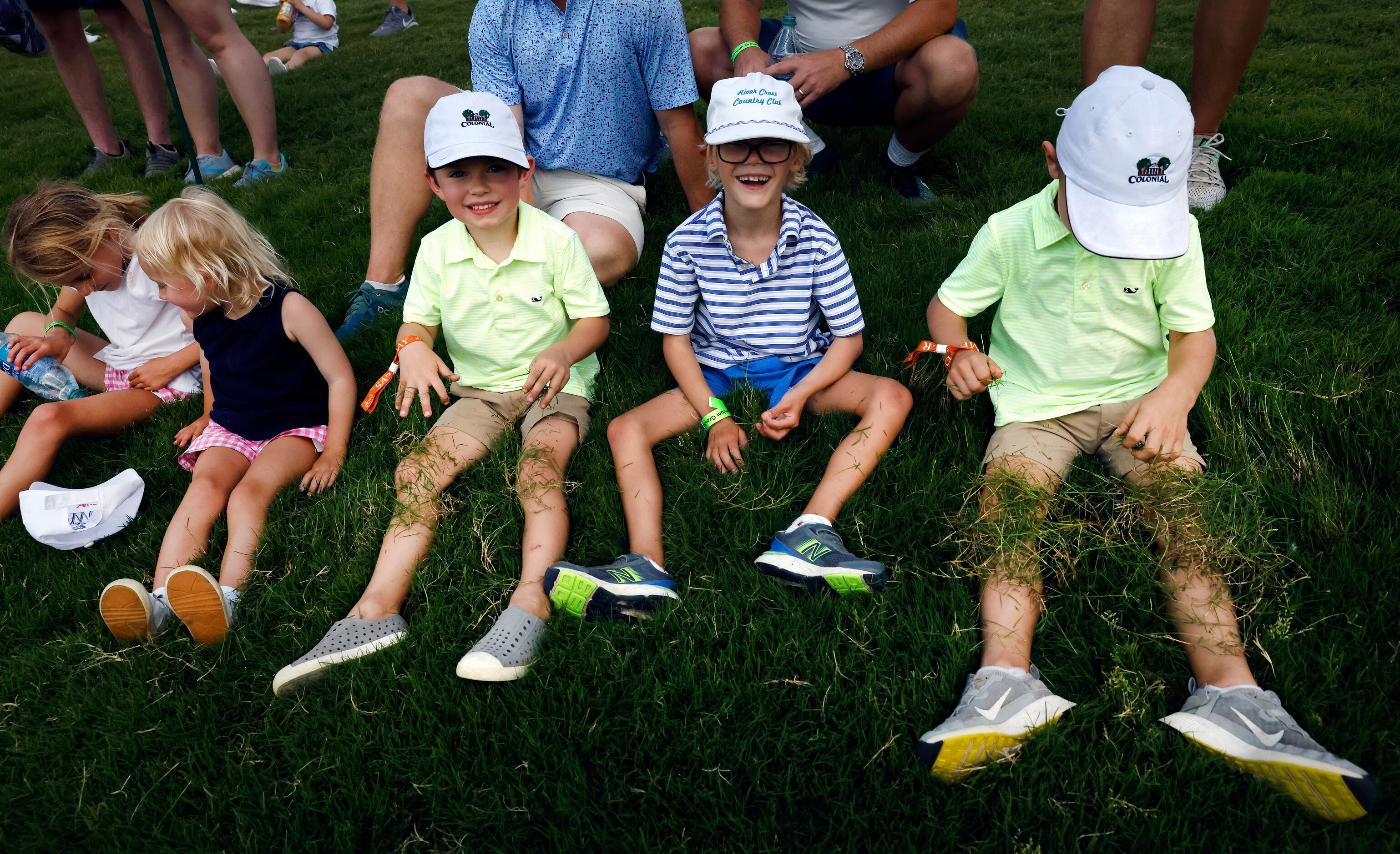 Kids waiting for professional golfer Jordan Spieth to play through on the 12th fairway,...