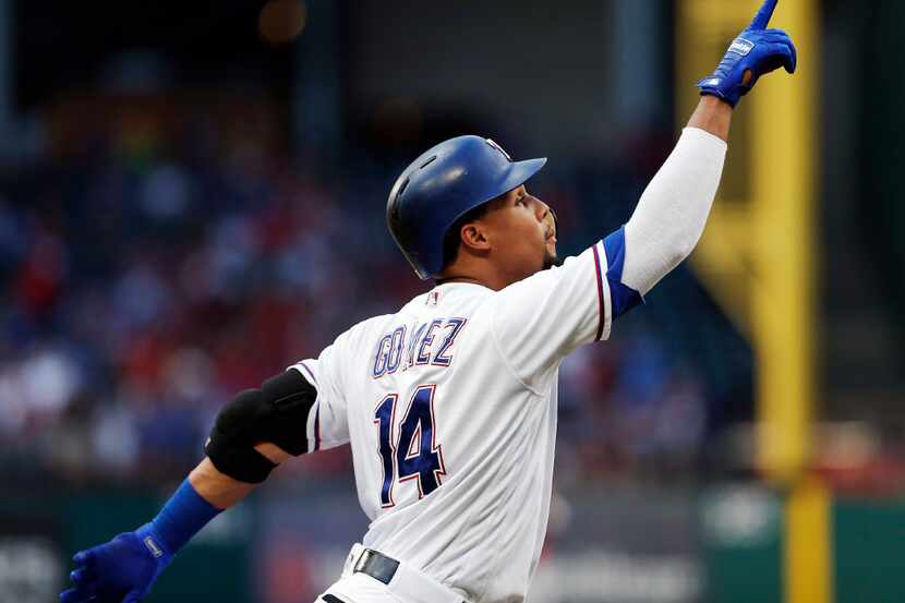 ARLINGTON, TX - SEPTEMBER 2: Carlos Gomez #14 of the Texas Rangers celebrates hitting a solo...