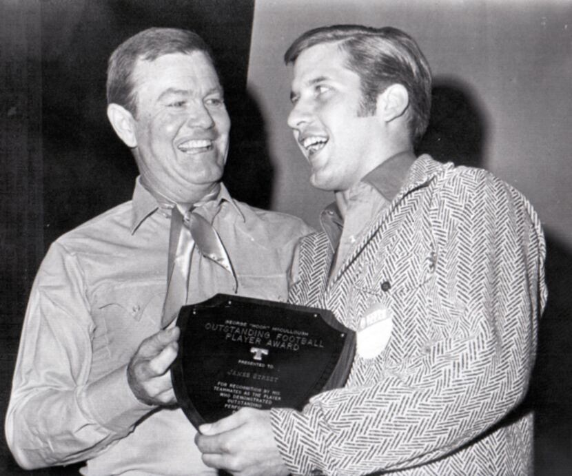 Coach Darrell Royal (left) presents Texas quarterback James Street the George "Hook"...