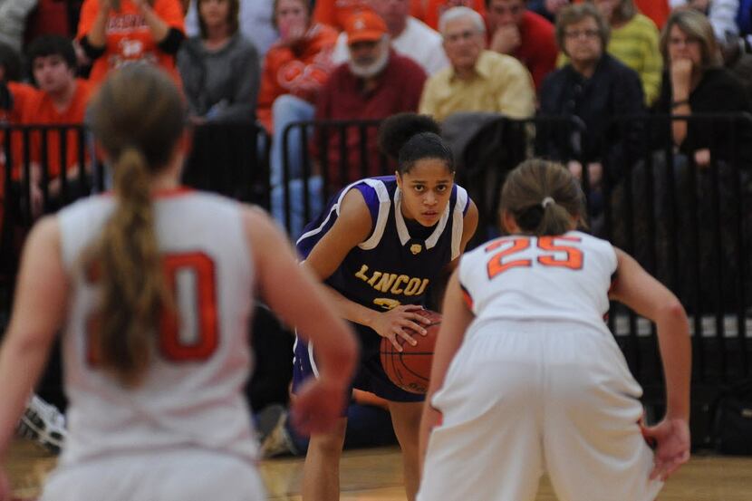 Lincoln's Cameasha Turner looks for a place to pass the ball. The Rockwall girls basketball...